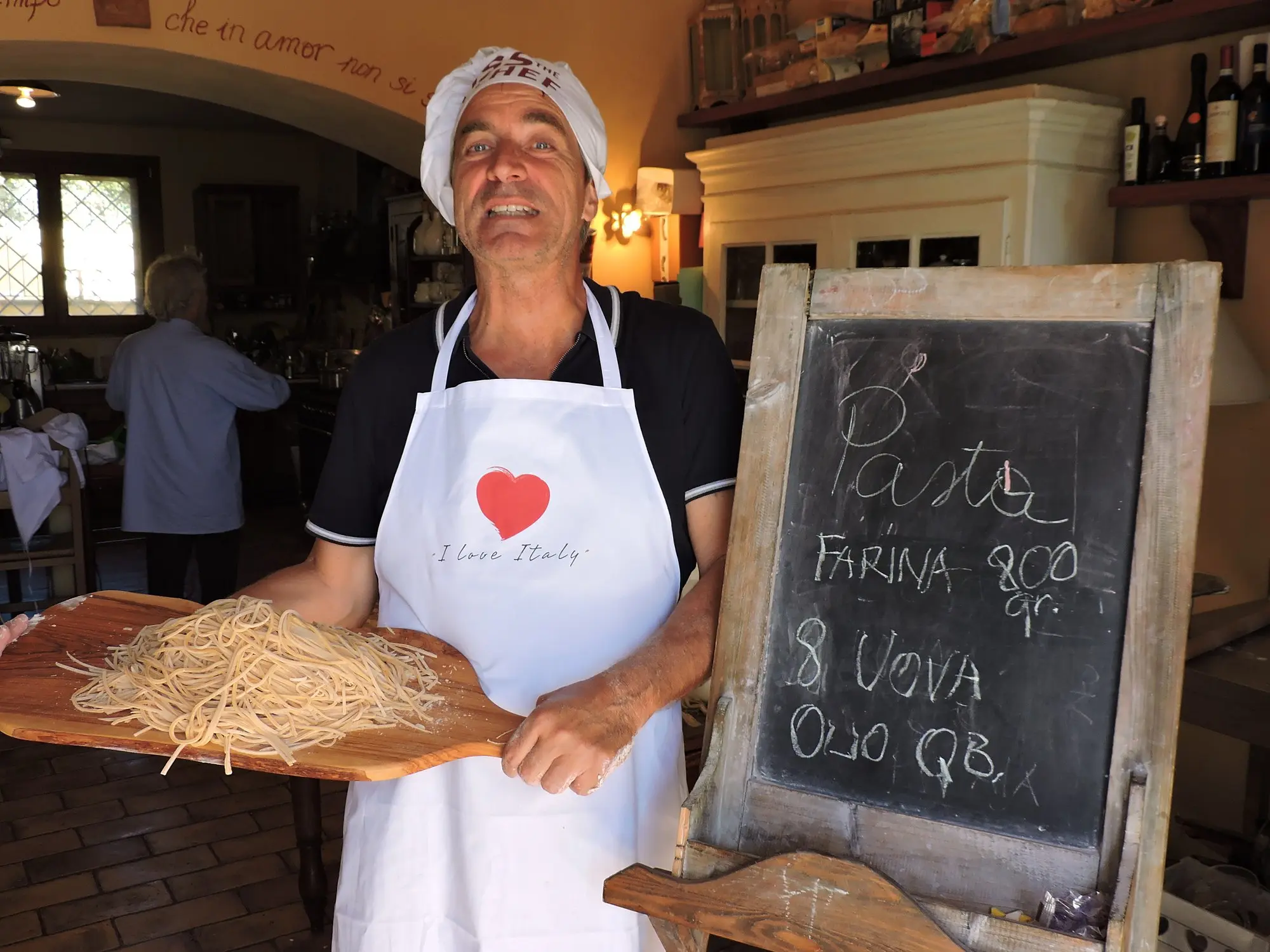 The pasta recipe written on the blackboard