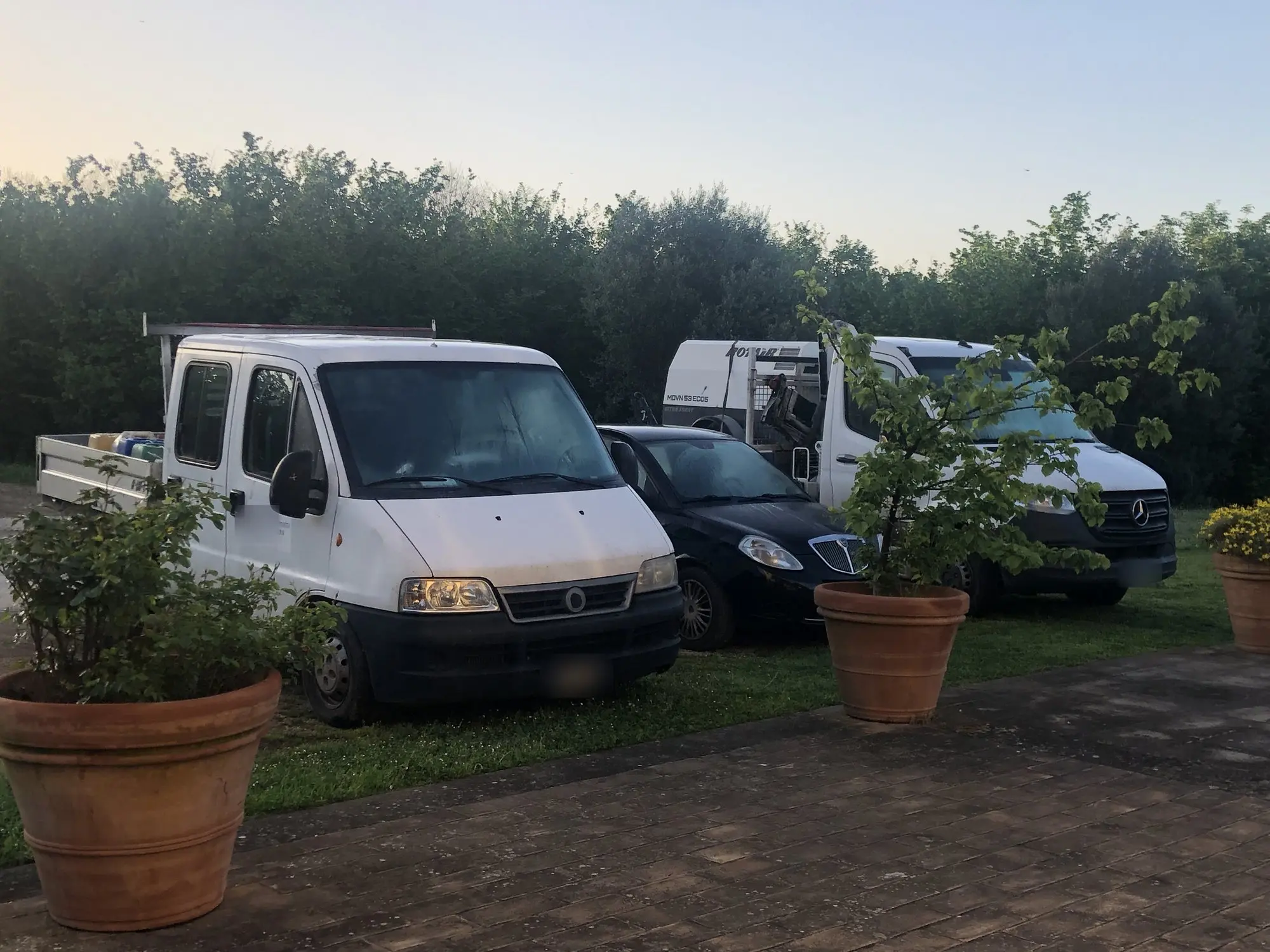 Vans and work vehicles in the yard
