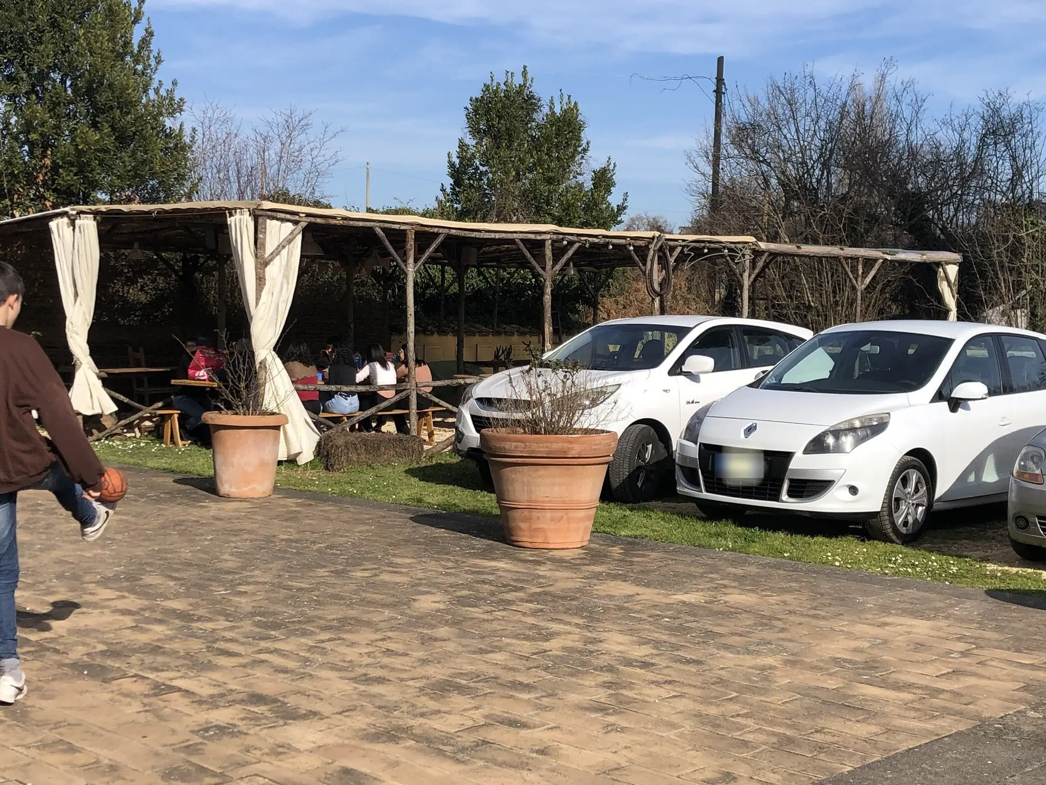 Cars parked beside the pergola