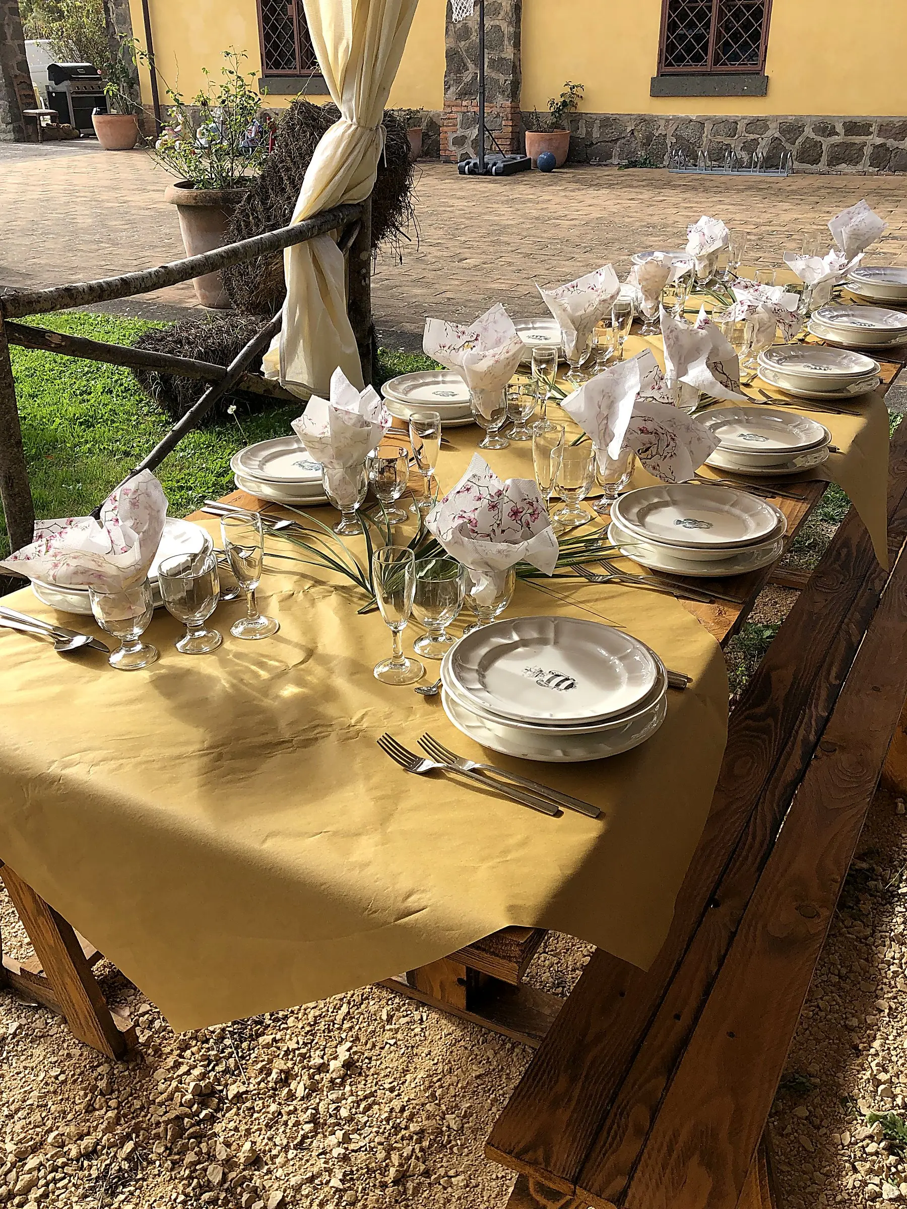 A table laid in the garden in front of the house for a celebration lunch